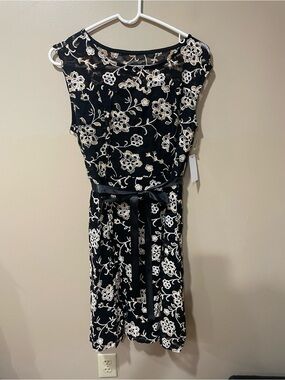 Elegant Black Midi Dress with White Floral Embroidery and Satin Tie
